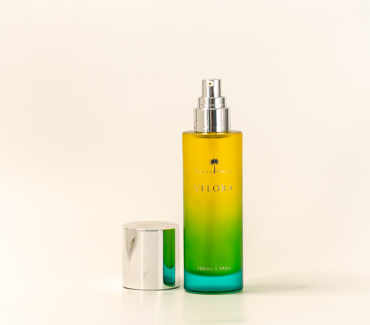 Rebel Palm Velora Night Body Oil pump bottle with silver cap removed, 100ml