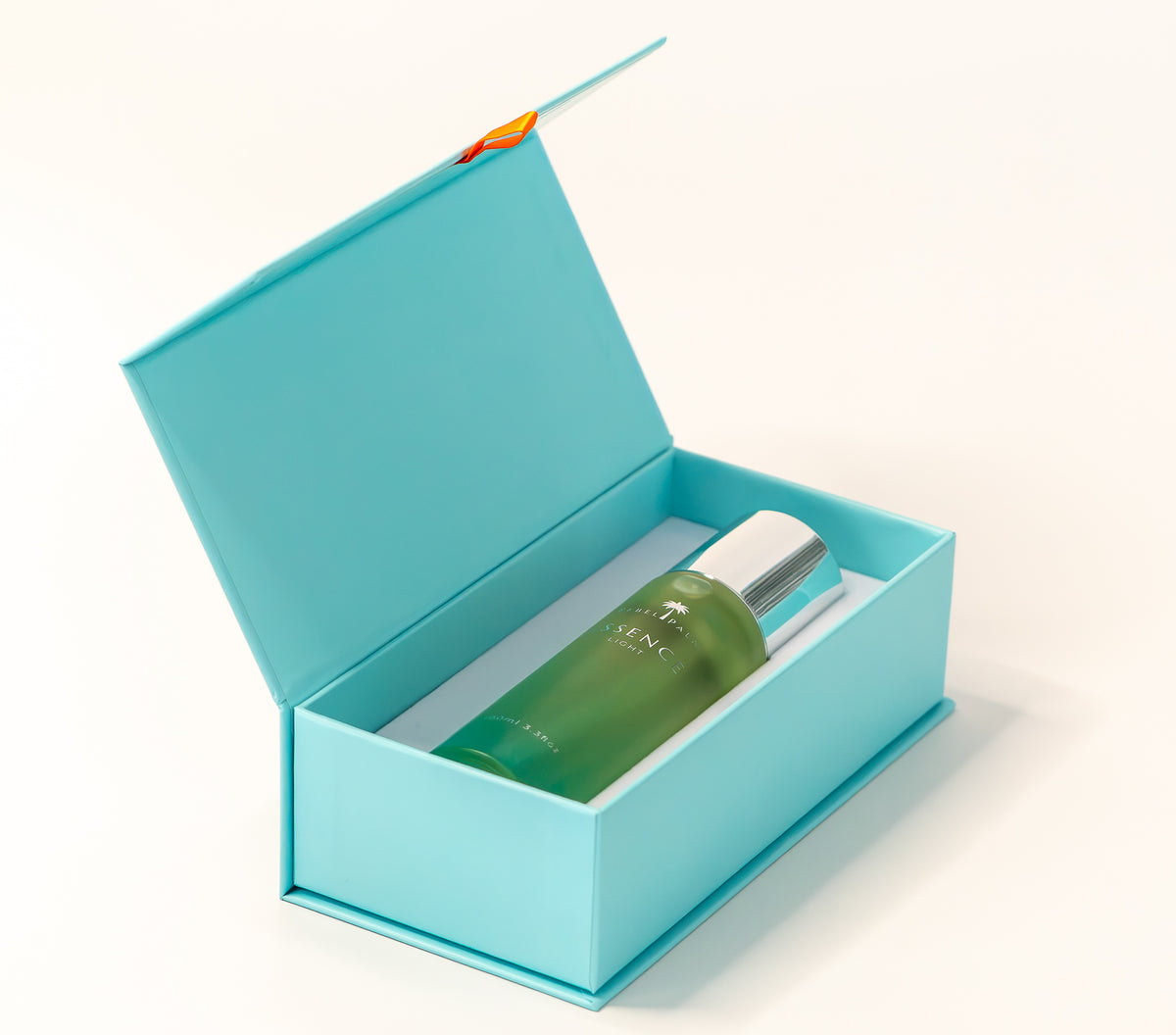 Rebel Palm Essence Light Body Oil 100ml – yellow to teal gradient glass bottle, studio shot