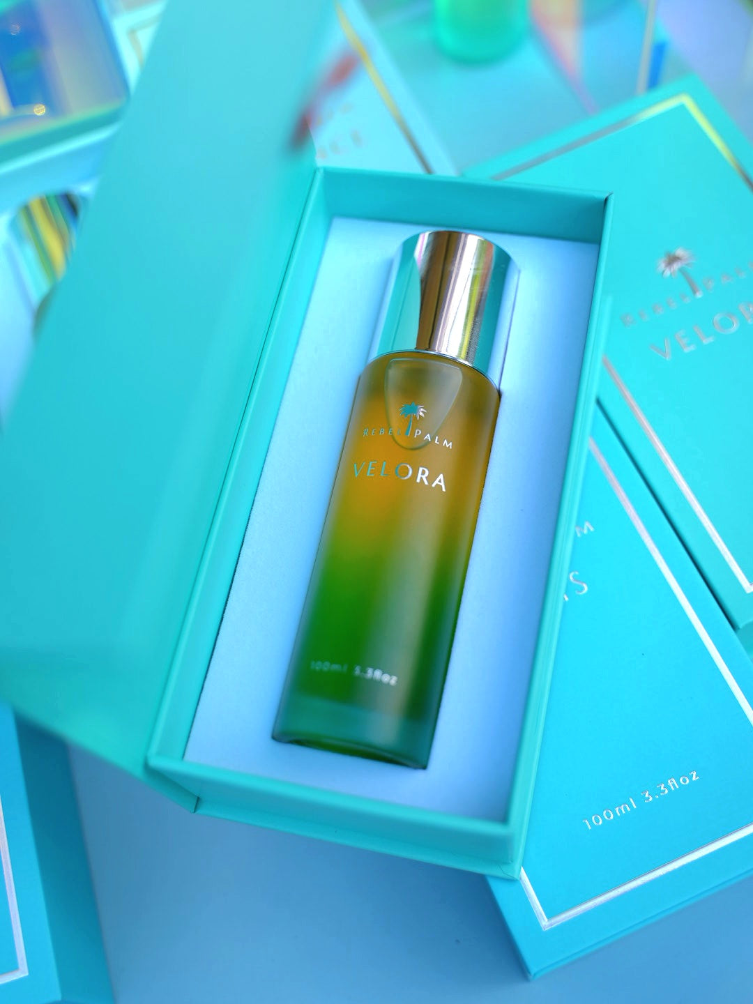 Rebel Palm Velora Night Body Oil nestled in luxury teal gift box, 100ml